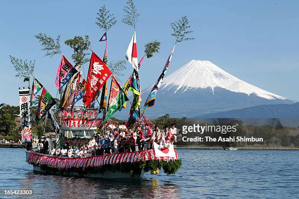 Fishermen and boys dressed and make-up as women dance on a decorated boat during annual Ose Festival at Suruga Bay on April 4, 2013 in Numazu,...