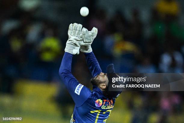 Sri Lanka's wicketkeeper Kusal Mendis successfully catches the ball to dismiss Bangladesh's Mohammad Naim during the Asia Cup 2023 super four one-day...