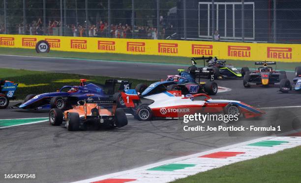 Jonny Edgar of Great Britain and MP Motorsport and Paul Aron of Estonia and PREMA Racing crash at the start during the Round 10:Monza Sprint race of...