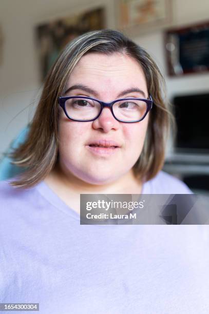 portrait of a young woman with down syndrome - developmental disability stock pictures, royalty-free photos & images
