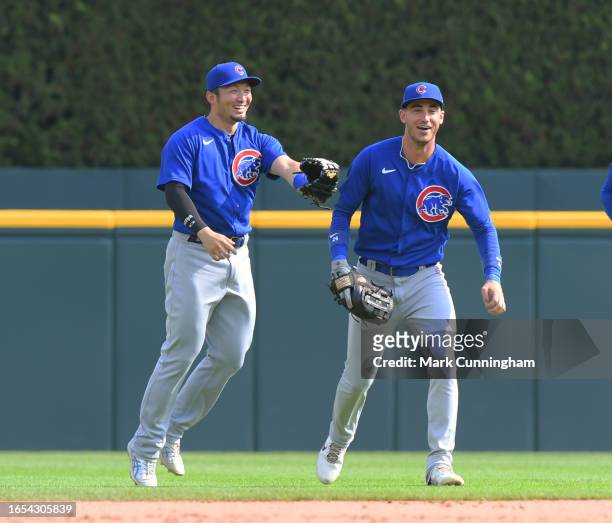 Seiya Suzuki and Cody Bellinger of the Chicago Cubs celebrate the victory against the Detroit Tigers at Comerica Park on August 23, 2023 in Detroit,...