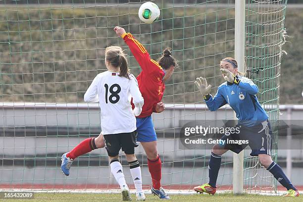 Raquel Pinel Saez of Spain scores her team's first goal against goalkeeper Meike Kaemper and Theresa Panfil of Germany during the Women's UEFA U19...