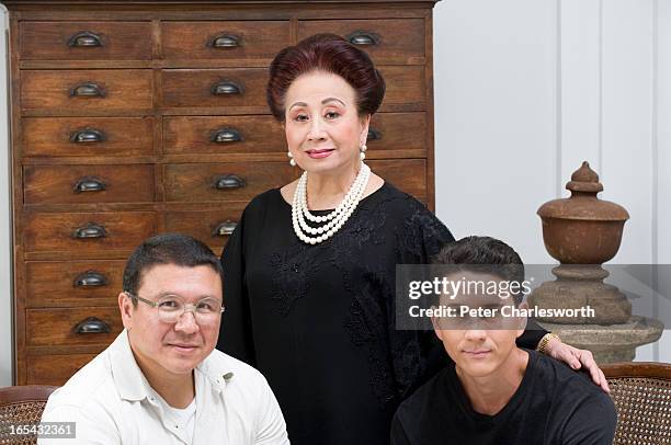 Kamala Sukosol, President of the Sukosol Hotels & Sukosol Group, posing for a portrait at the new Siam Hotel with her sons, Sukie Clapp and Krissada...