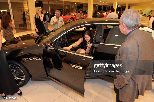 Guests attend the unveiling of the new Maserati Quattroporte at Ferrari Maserati Silicon Valley on April 3, 2013 in Redwood City, California.