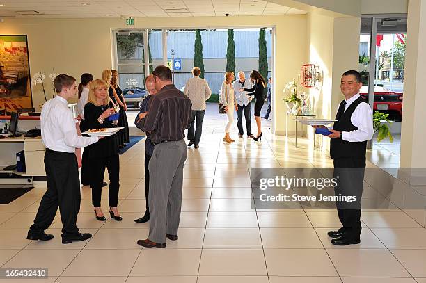 Guests attend the unveiling of the new Maserati Quattroporte at Ferrari Maserati Silicon Valley on April 3, 2013 in Redwood City, California.