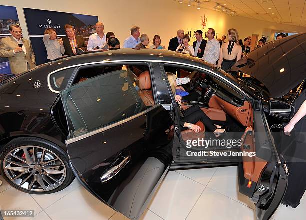 Guests attend the unveiling of the new Maserati Quattroporte at Ferrari Maserati Silicon Valley on April 3, 2013 in Redwood City, California.