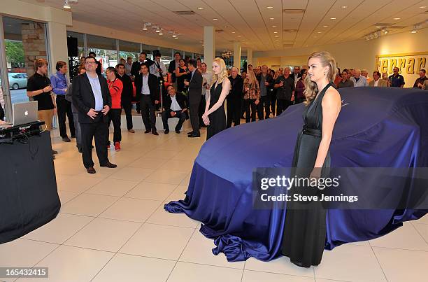 Guests attend the unveiling of the new Maserati Quattroporte at Ferrari Maserati Silicon Valley on April 3, 2013 in Redwood City, California.