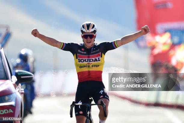 Team Quick Step's Belgian rider Remco Evenepoel celebrates winning the stage 14 of the 2023 La Vuelta cycling tour of Spain, a 156,2 km race between...
