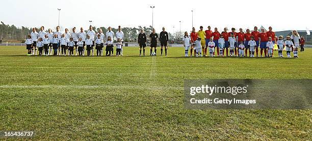 Both teams stand for the national anthem prior to the Women's UEFA U19 Euro Qualification match between U19 Germany and U19 Spain at Waldstadion in...