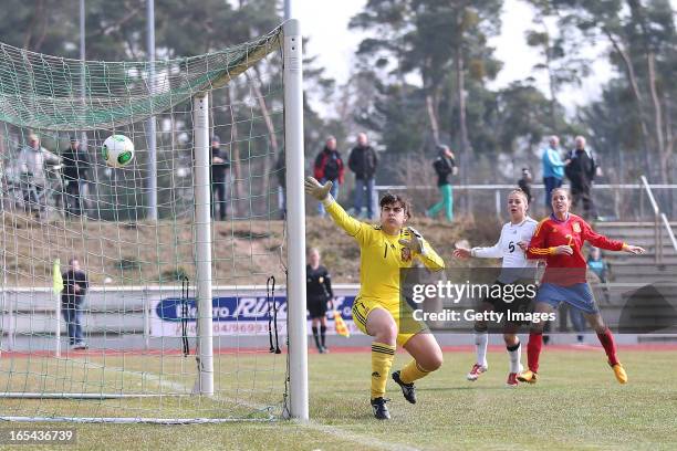 Lina Magull of Germany scores her team's first goal against goalkeeper Ane Ochoa de Zuazola of Spain during the Women's UEFA U19 Euro Qualification...