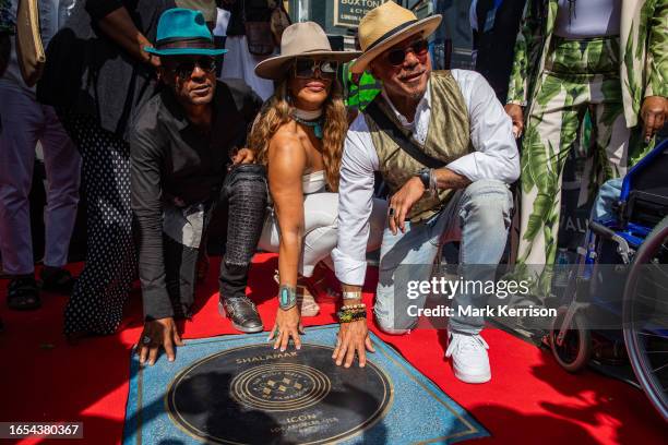 Jeffrey Daniel , Carolyn Griffey and Howard Hewett of Shalamar pose during the unveiling of their stone at the Music Walk of Fame in Camden on 9...