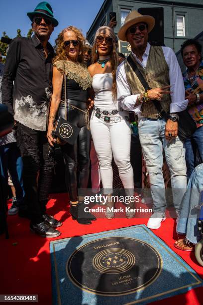 Jeffrey Daniel, Carolyn Griffey and Howard Hewett of Shalamar pose with Carrie Lucas during the unveiling of Shalamar's stone at the Music Walk of...