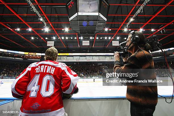 November 26, 2008 A television cameraman works beside Lokomotiv Yaroslavl back up goalie Sergei Zvyagin during a KHL game against Lada Tolyatti at...