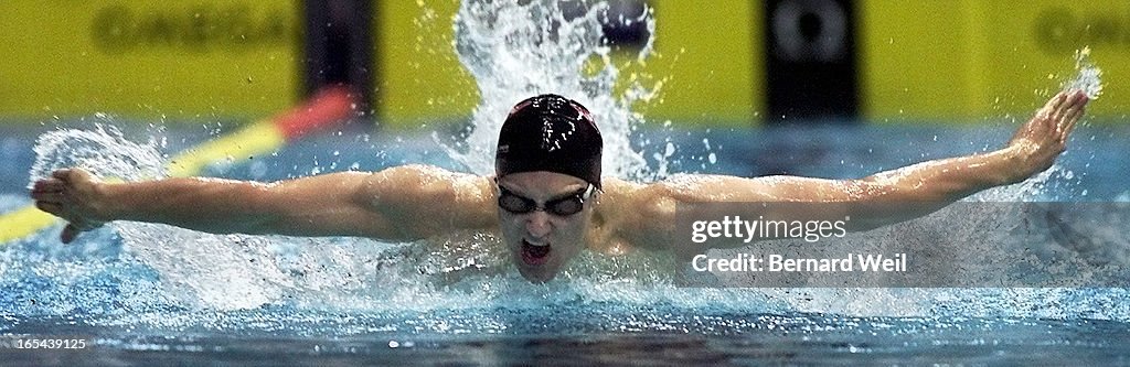 DIGITAL IMAGE-Adam Sioui churns through the water in the Mens Senior 200 Fly event, Wednesday May 31