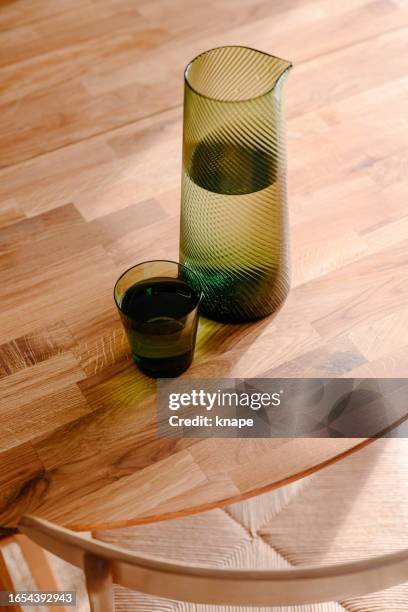 water glass and jug in sunlight on kitchen table - the oak room stock pictures, royalty-free photos & images