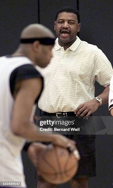 Toronto Raptors coach Butch Carter works with Vince Carte during an afternoon practise at the Air Canada Centre, April 28, 2000.