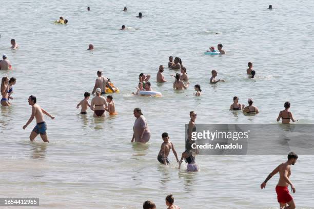 People swim in the sea during late summer heatwave as temperatures are expected to reach 32 degrees Celsius in many parts of the UK, making it the...