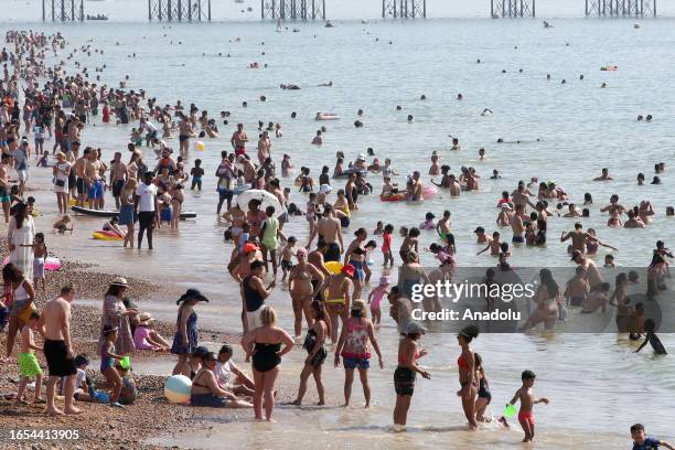 People swim in the sea during late summer heatwave as temperatures are expected to reach 32 degrees Celsius in many parts of the UK, making it the...