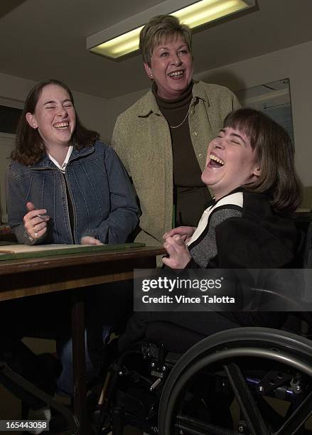 Laura Booth Laura Boothright, shares a laugh with her sister Leslie,left, and mom ...