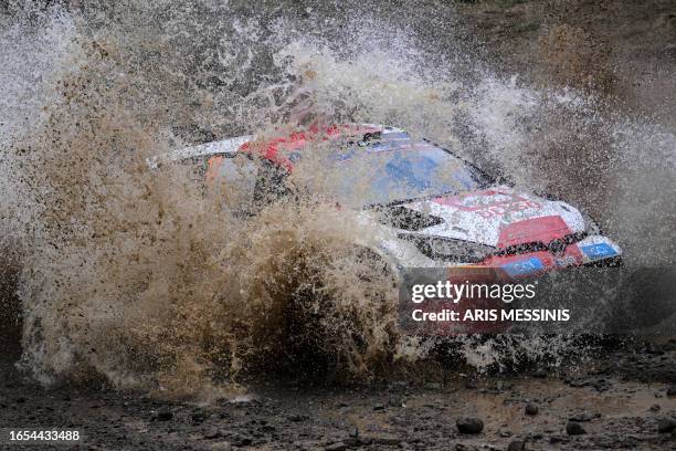 French driver Sebastien Ogier with his co-driver Vincent Landais drive their Toyota GR Yaris Rally 1 Hybrid at the special stage Pavliani during the...