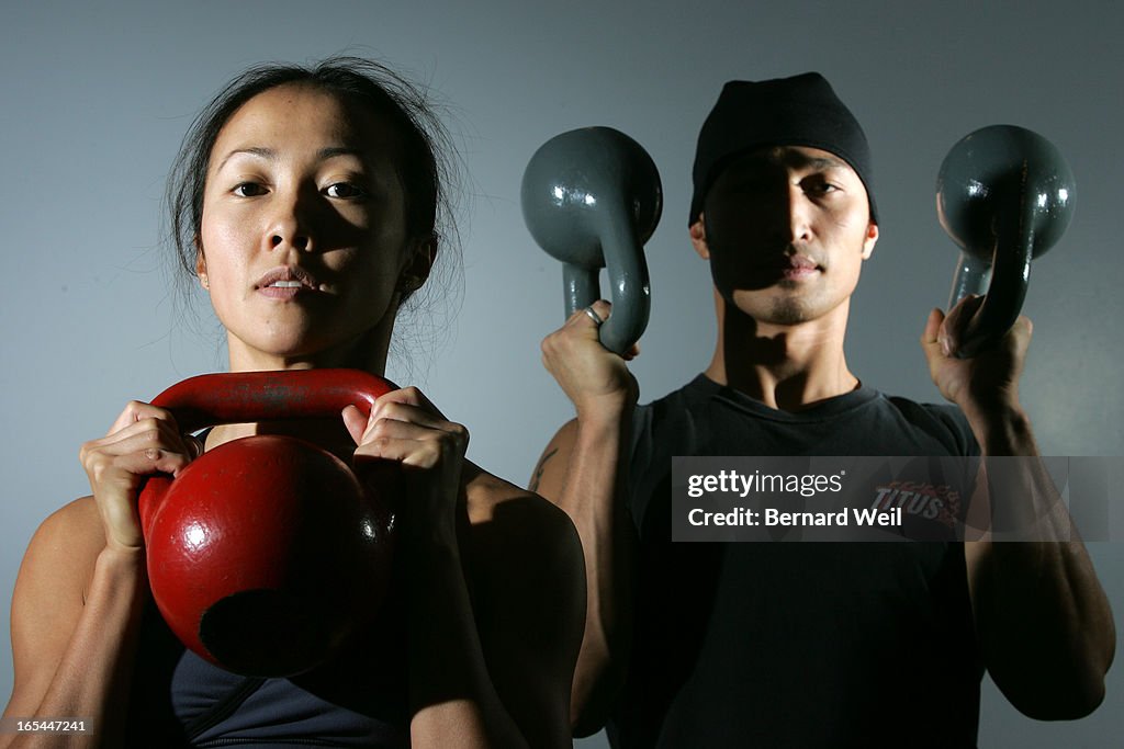 KettleBell_BW02_112504--Virginia Lee and Edwin d Lleon show their form as demonstrating an ancient R