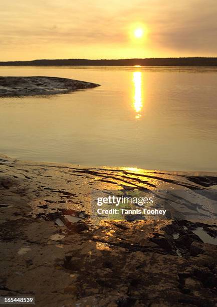 Yellowknife-June 13 2005-A 4am 'sunrise' over Yellowknife's Great Slave Lake in the North West Territories, shot by paddling out to a small island...