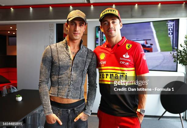 Charles Leclerc of Monaco and Ferrari meets Damiano David in the Paddock prior to final practice ahead of the F1 Grand Prix of Italy at Autodromo...