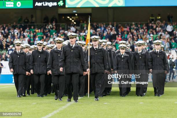Soldiers of the Navy marching prior to the Aer Lingus College Football Classic match between Notre Dame and Navy at Aviva Stadium on August 26, 2023...