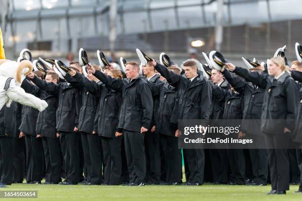 Soldiers of the Navy lifts their hats prior to the Aer Lingus College Football Classic match between Notre Dame and Navy at Aviva Stadium on August...
