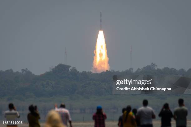 People watch the Indian Space Research Organisation’s PSLV-C57 rocket carrying the Aditya-L1 solar mission lift off from the Satish Dhawan Space...