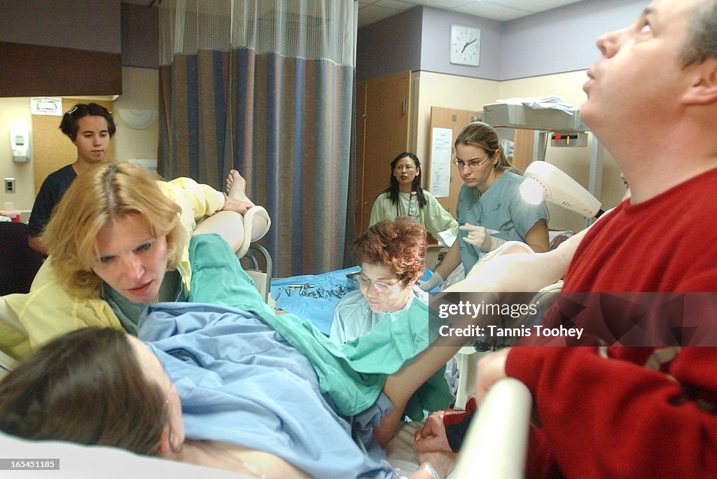 FORCEPS_05-March 21, 2002-Nurse Mary Villalobos explains to mother in labour, Sandra Dewar what is h