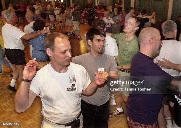 Partners promenade as they follow the calls during the gay square dancing convention at Royal York Hotel in Toronto Sunday July 7, 2002.