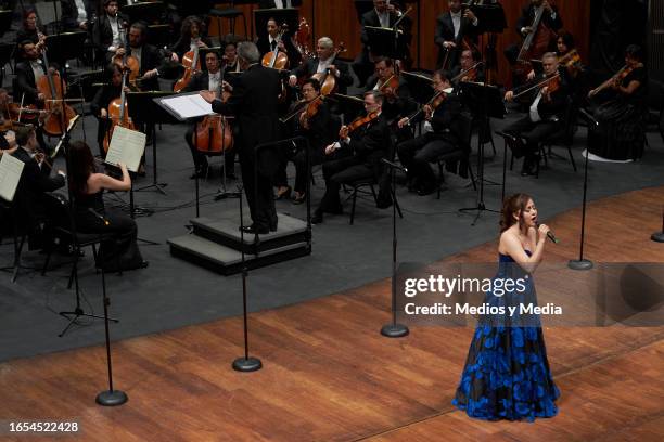 Estudio de la Ópera de Bellas Artes member performs during the symphonic tribute to late singer and composer Jose Alfredo Jimenez at Palacio de...