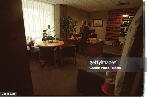 Pics of Tom Jakobek in his office looking towards the window with mood on his face.Tight and loose.