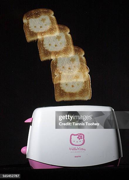 July 10, 2003-Hello Kitty toaster which toasts the Hello Kitty emblem right onto the bread, shot in Toronto Star, July 10, 2003.