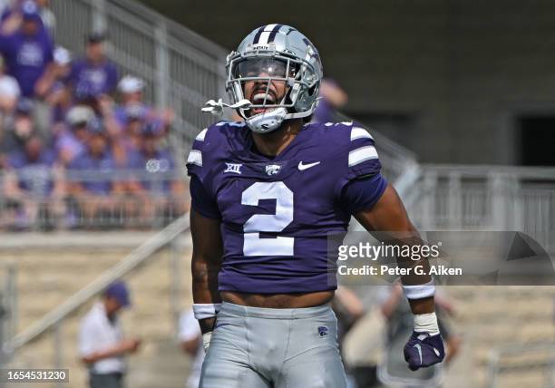 Safety Kobe Savage of the Kansas State Wildcats reacts after a defensive stop on a fourth down against the Troy Trojans in the first half at Bill...