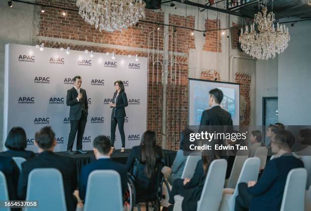 asian chinese business conference participant asking questions during seminar to host - press conference stage stock pictures, royalty-free photos & images