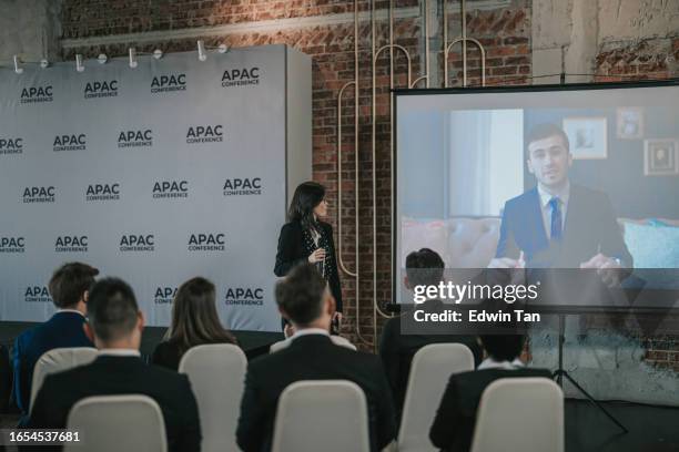 asian business people video conference call projector screen in meeting room. diverse team of creative entrepreneurs at seminar discussion. specialists work in digital e-commerce startup - zoom participant stock pictures, royalty-free photos & images