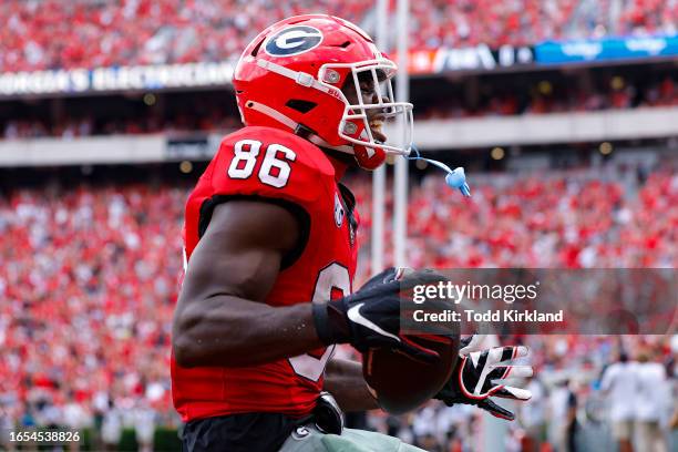 Dillon Bell of the Georgia Bulldogs reacts after a touchdown during the second quarter against the Ball State Cardinals at Sanford Stadium on...