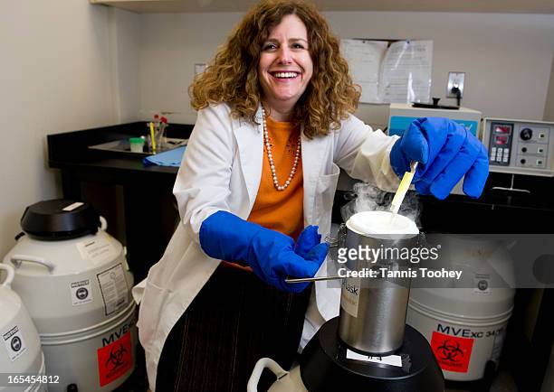 Dr. Karen Glass with the liquid nitrogen used to store oocytes and embryos before their transfer into more permanent storage at 'Create' a fertility...