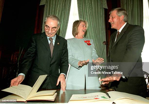 Talotta 1 - Italian Prime Minister shares a moment with Hillary Weston and Premier Mike Harris as he signs the VIP guest book.