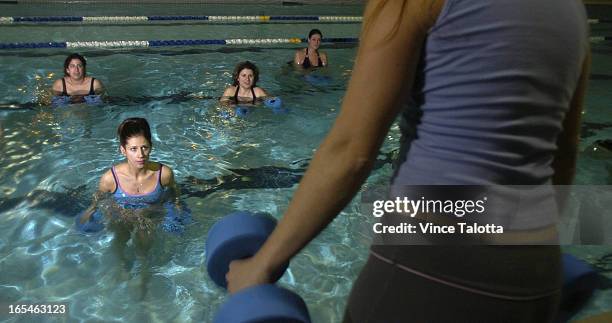 And ME fitness instructor Marnie Kennedy at the in-water portion of the class of pregnant women. Some women that take in this program are Elisha...