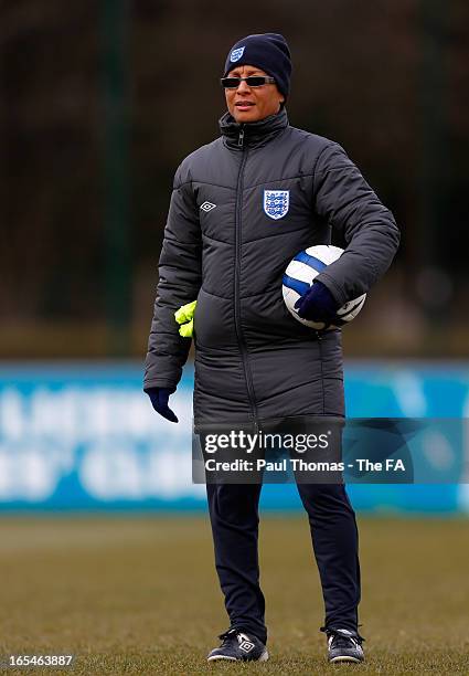 Manager Hope Powell of England watches on during a training session ahead of their International friendly match against Canada at St George's Park on...