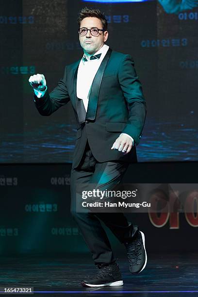 Actor Robert Downey Jr. Dances to a song by South Korean rapper Psy during the 'Iron Man 3' South Korea Premiere at Times Square on April 4, 2013 in...