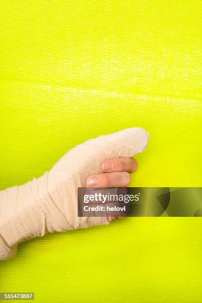 broken thumb - bandaged thumb stock pictures, royalty-free photos & images