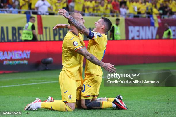 Denis Alibec of Romania celebrates the goal scored with his teammate Nicolae Stanciu during the UEFA EURO 2024 European qualifier match between...