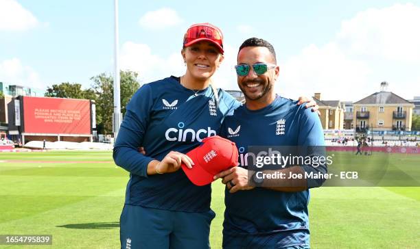 Sarah Glenn of England is presented with a cap by Gareth Breese, Coach of England ahead of their 50th appearance ahead of the 2nd Vitality IT20 match...