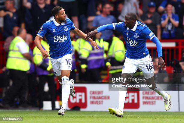 Arnaut Danjuma of Everton celebrates with teammate Abdoulaye Doucoure after scoring the team's second goal during the Premier League match between...