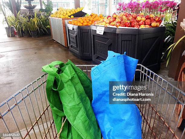 reusable bags in cart - huntington beach market stock-fotos und bilder