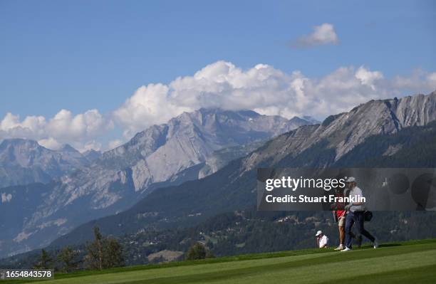 Kalle Samooja of Finland and caddie walk on the seventh hole during Day Three of the Omega European Masters at Crans-sur-Sierre Golf Club on...